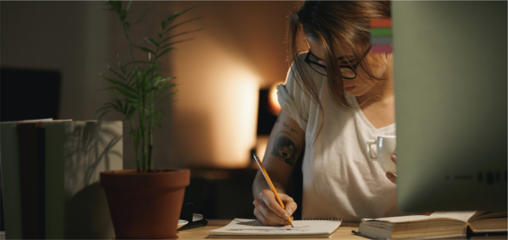 A shot of someone writing or using a computer, symbolizing the process of careful editing and proofreading, which includes deciding on punctuation like the Oxford comma